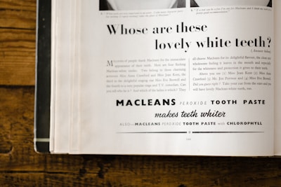 An advertisement page from a magazine featuring a promotional text for Macleans Peroxide Tooth Paste. The ad includes a headline asking about lovely white teeth, with a detailed marketing message below explaining the benefits of the toothpaste and a list of celebrities endorsing it. The page is slightly yellowed, suggesting it is vintage, possibly from around the mid-20th century. The text employs a mix of fonts and sizes, with the brand name prominently displayed.