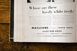An advertisement page from a magazine featuring a promotional text for Macleans Peroxide Tooth Paste. The ad includes a headline asking about lovely white teeth, with a detailed marketing message below explaining the benefits of the toothpaste and a list of celebrities endorsing it. The page is slightly yellowed, suggesting it is vintage, possibly from around the mid-20th century. The text employs a mix of fonts and sizes, with the brand name prominently displayed.