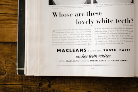 An advertisement page from a magazine featuring a promotional text for Macleans Peroxide Tooth Paste. The ad includes a headline asking about lovely white teeth, with a detailed marketing message below explaining the benefits of the toothpaste and a list of celebrities endorsing it. The page is slightly yellowed, suggesting it is vintage, possibly from around the mid-20th century. The text employs a mix of fonts and sizes, with the brand name prominently displayed.