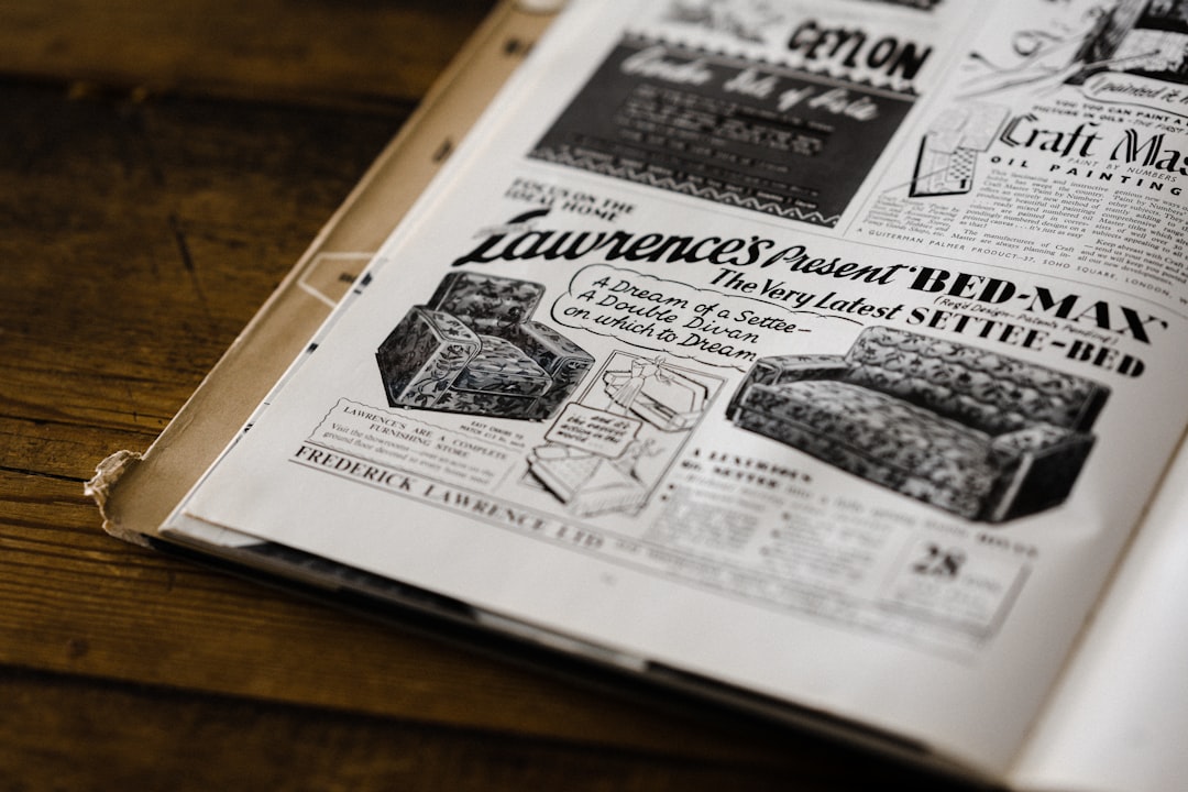 white newspaper on brown wooden table