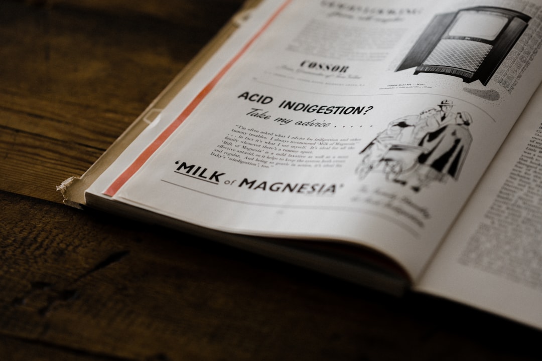 white book page on brown wooden table