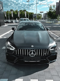 black mercedes benz car on road during daytime