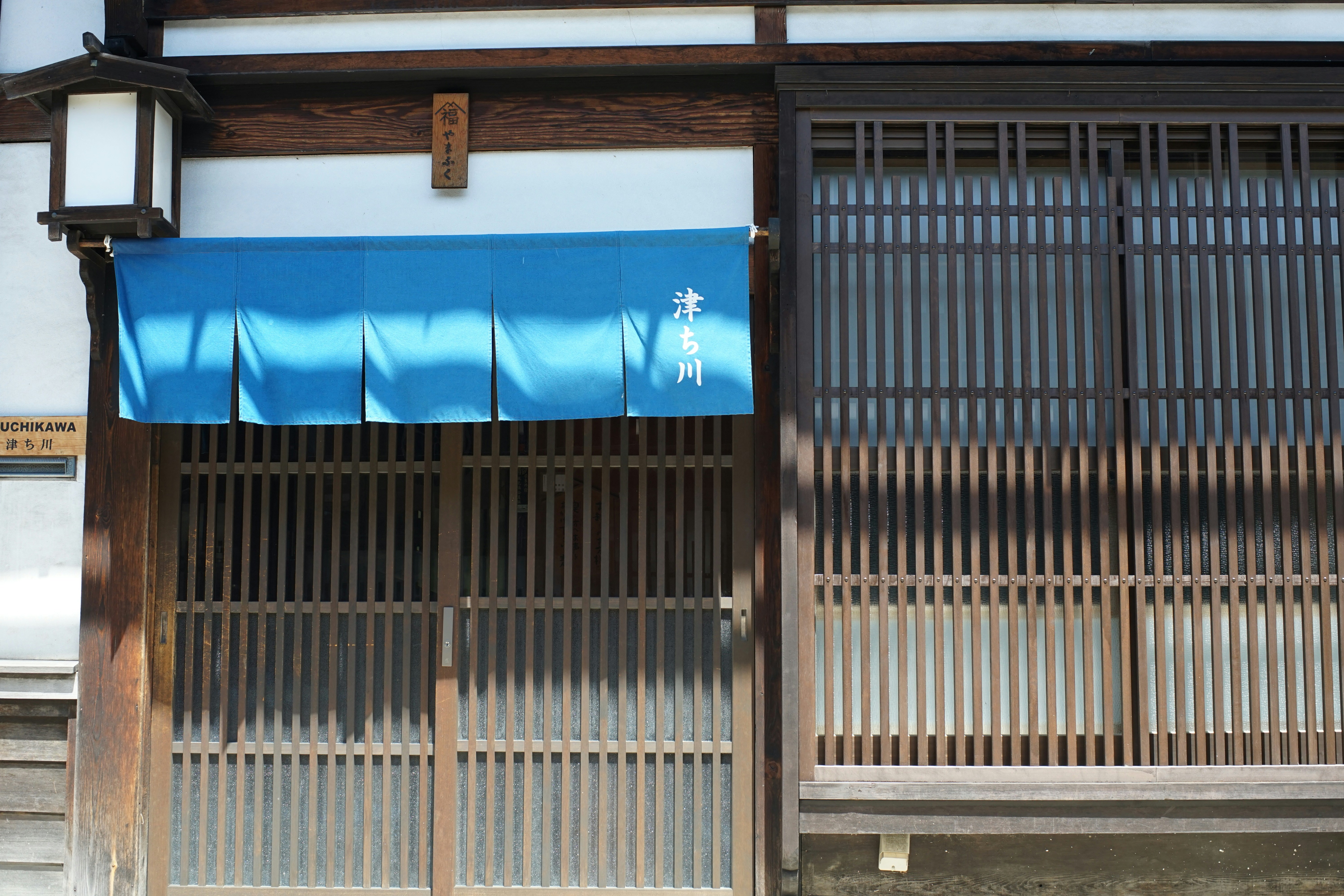 Onsen entrance with blue curtain for men and red curtain for women