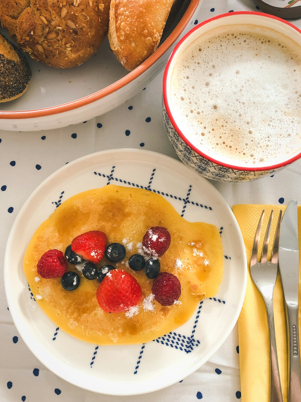 white ceramic plate with red and black berries