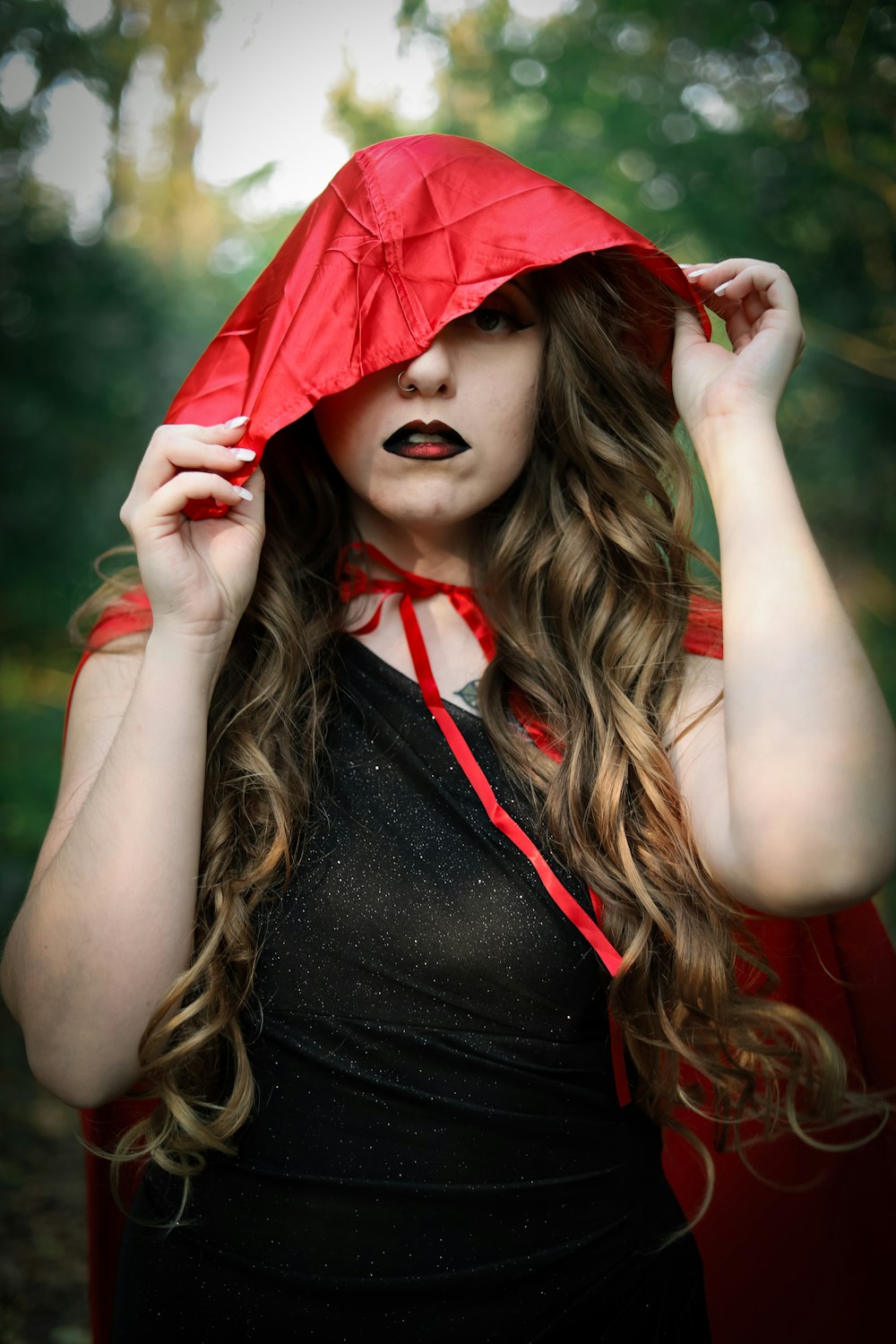 woman in black tank top wearing red hat