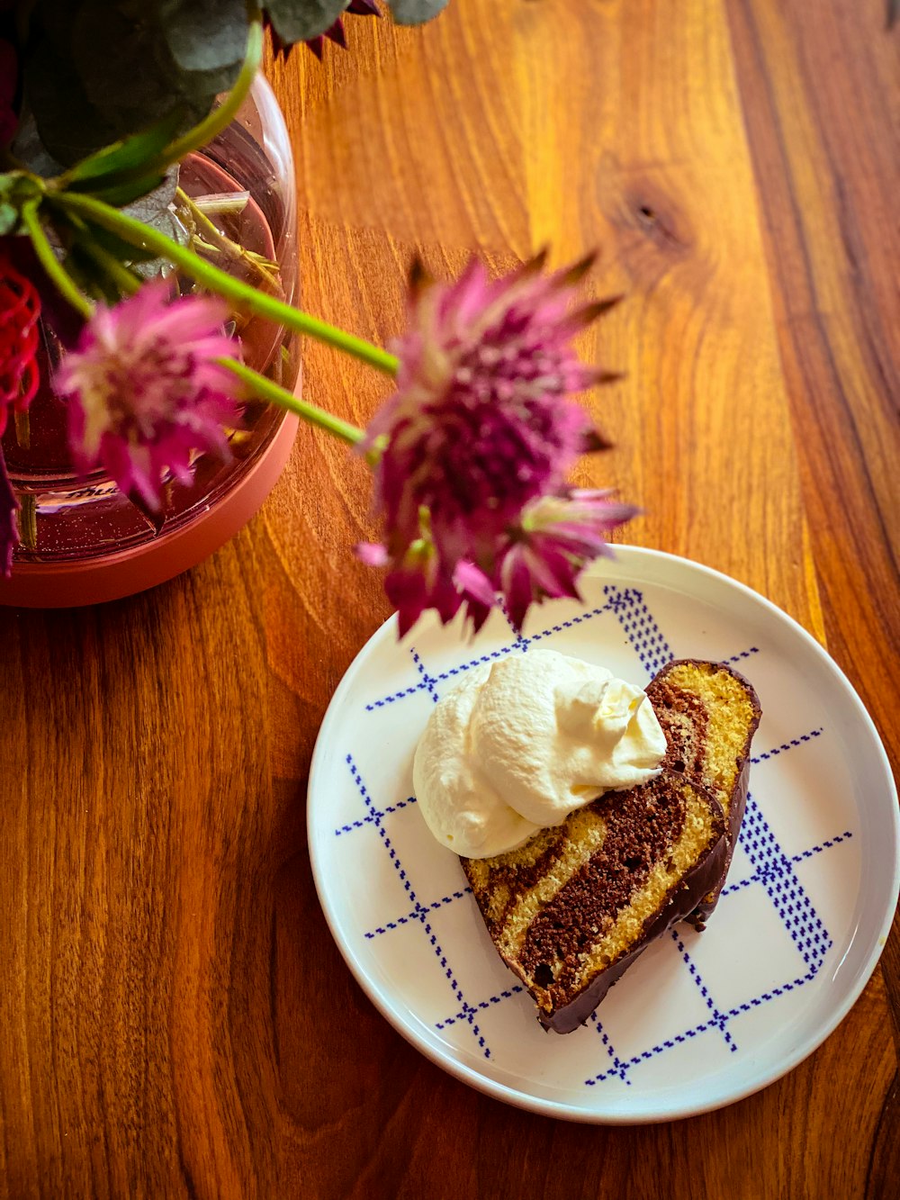 white and brown bread on white and blue ceramic plate