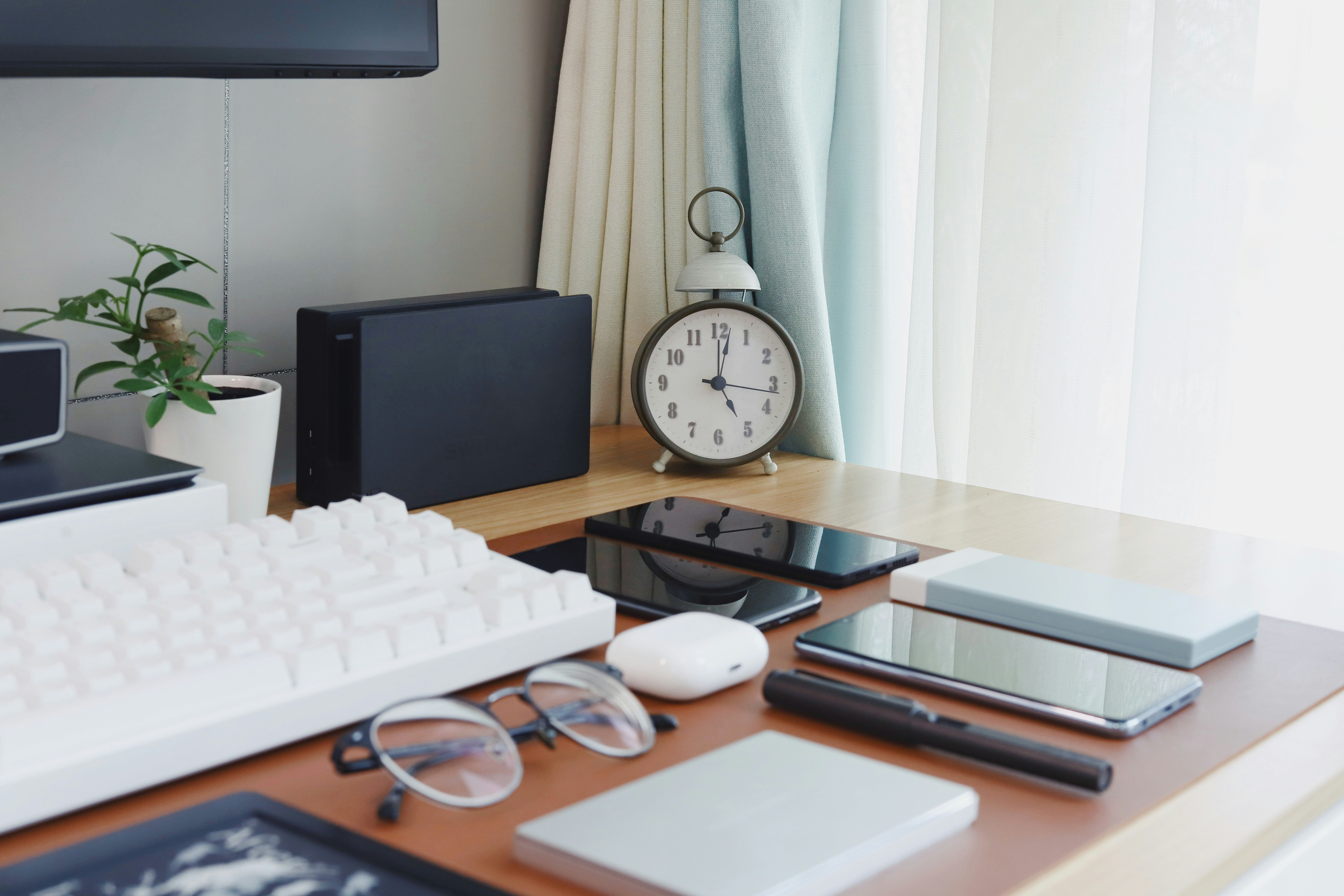 black flat screen computer monitor on brown wooden desk