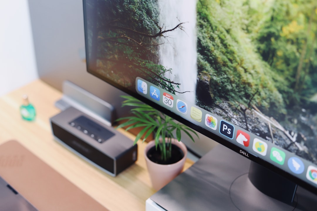 silver imac on white table