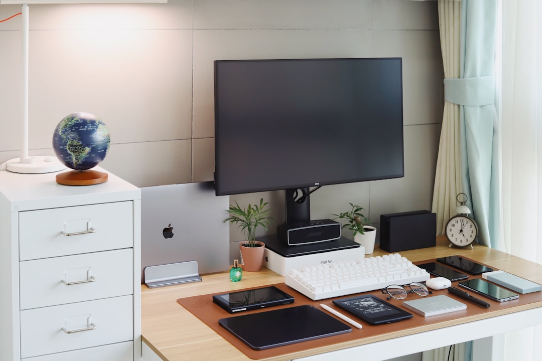 black flat screen tv on white wall