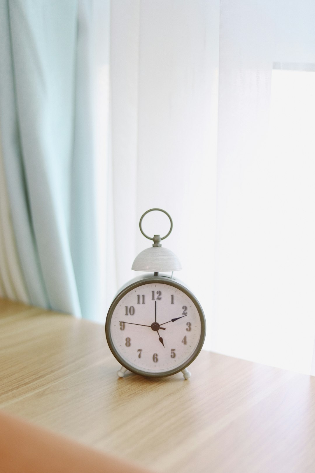 white and silver alarm clock