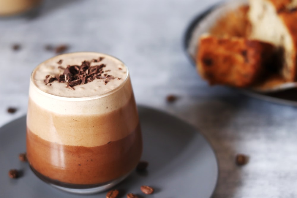 clear glass cup with brown liquid