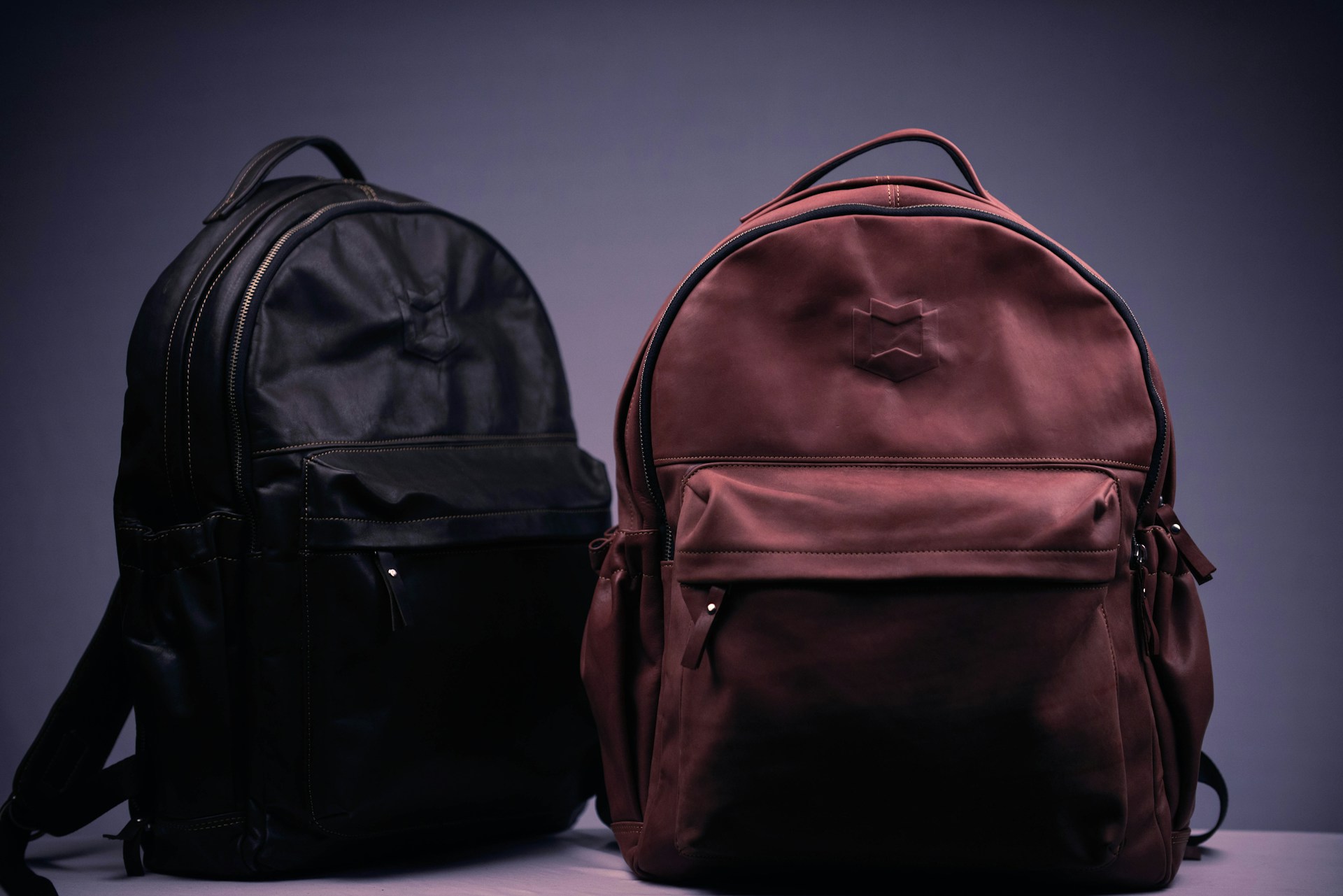 black and brown backpack on white textile