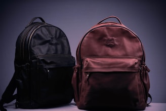 black and brown backpack on white textile