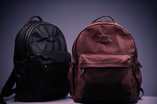 black and brown backpack on white textile