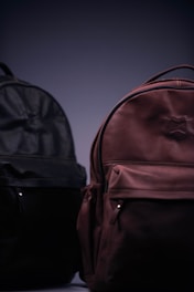 black and brown backpack on black surface