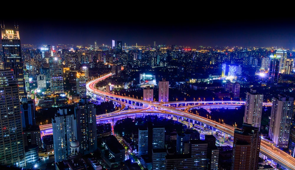 city with high rise buildings during night time