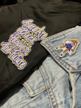 Close-up of a premium school jacket featuring detailed custom embroidery