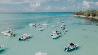 white and red boats on sea during daytime