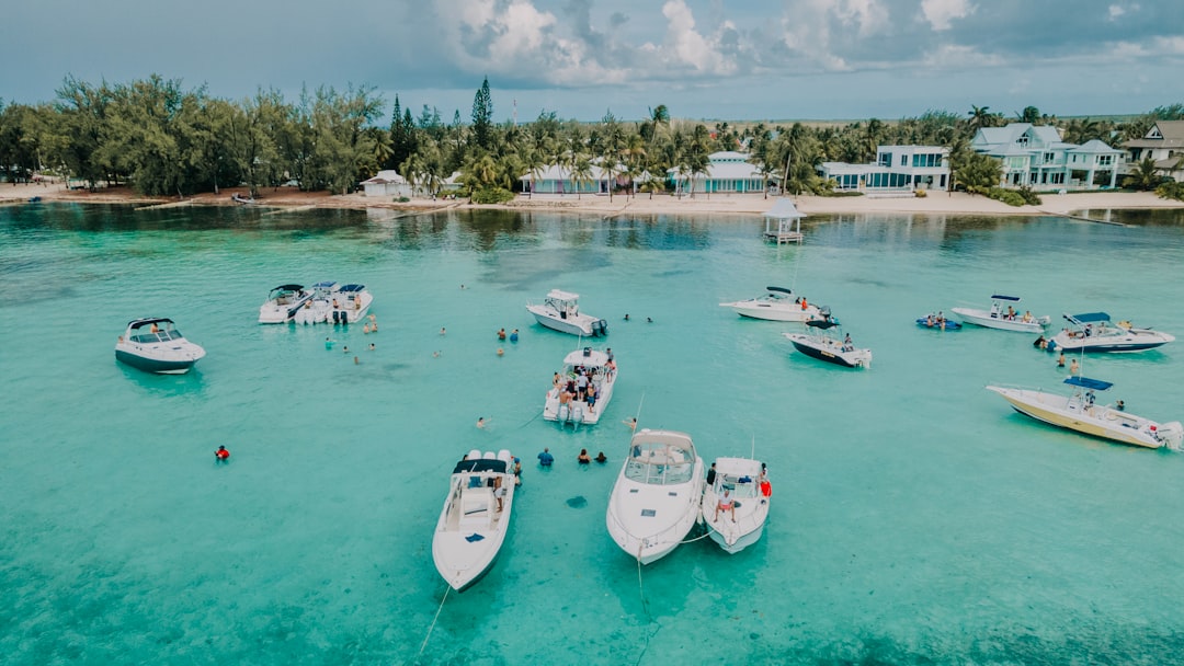 white and blue boats on sea during daytime