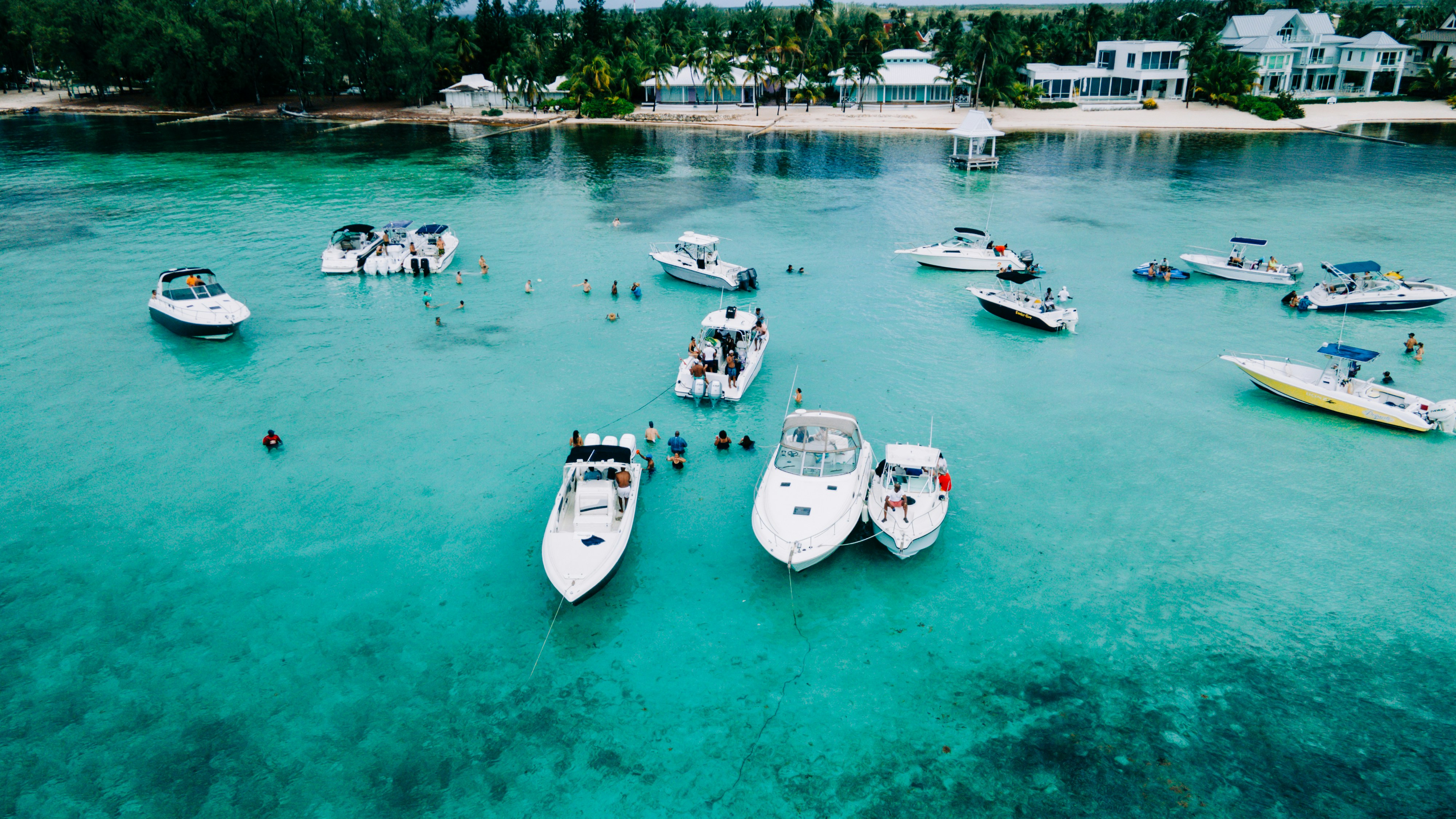 white and blue boats on sea during daytime, Cayman islands 