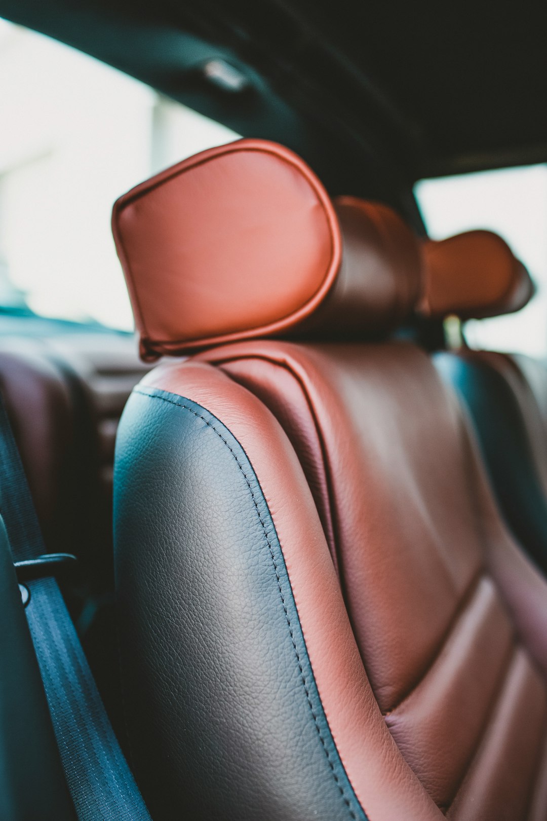 brown leather car seat during daytime