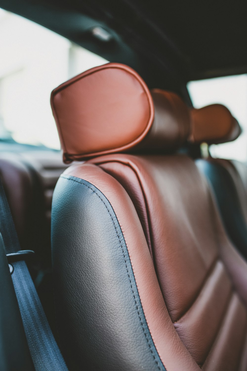 brown leather car seat during daytime