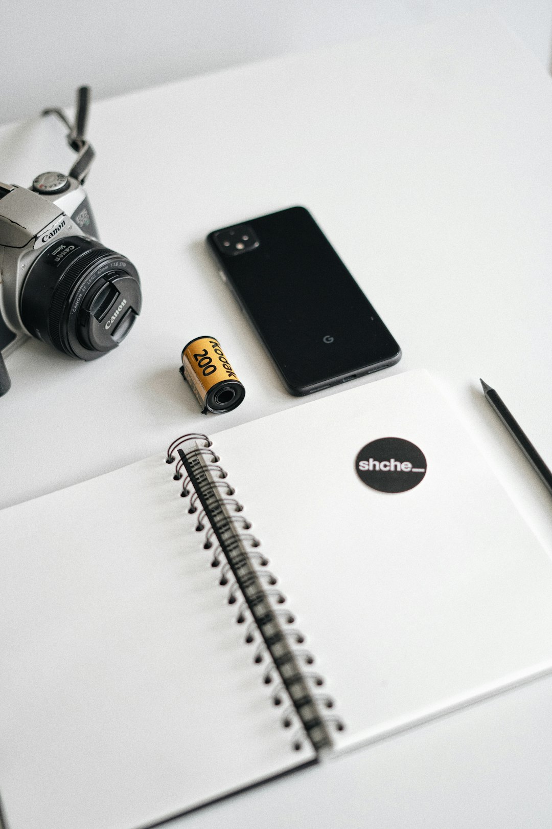 black iphone 7 beside silver and gold watch and silver macbook