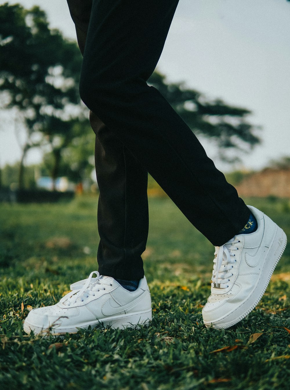 person wearing black and white nike sneakers photo – Free Image on Unsplash