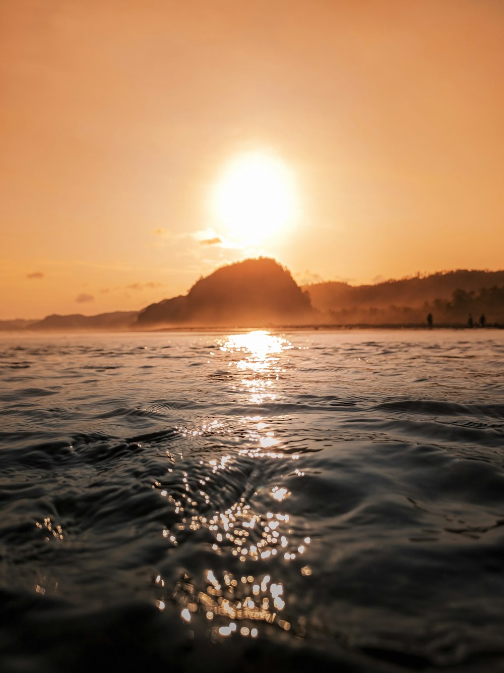 body of water during sunset