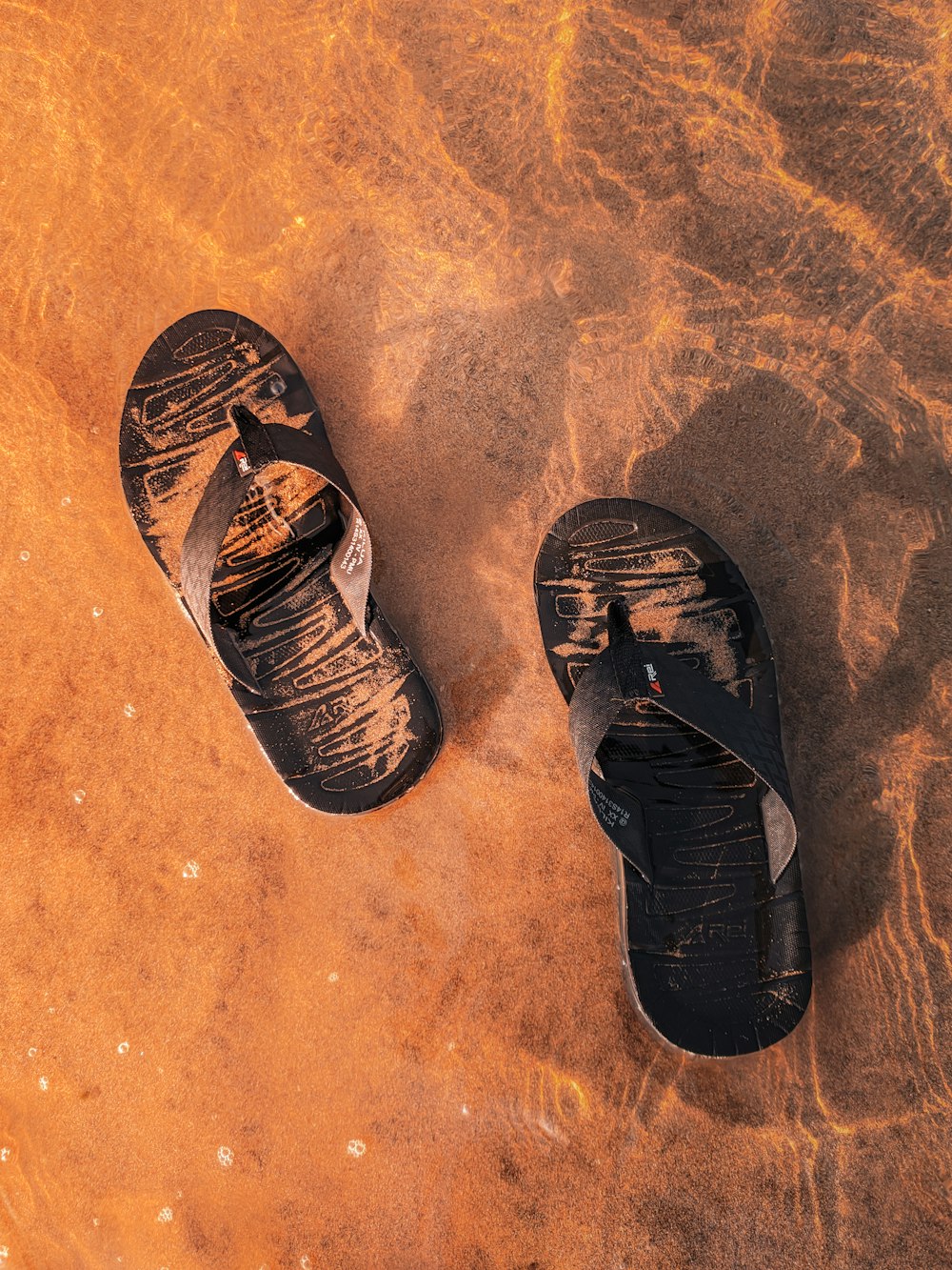 black and brown flip flops