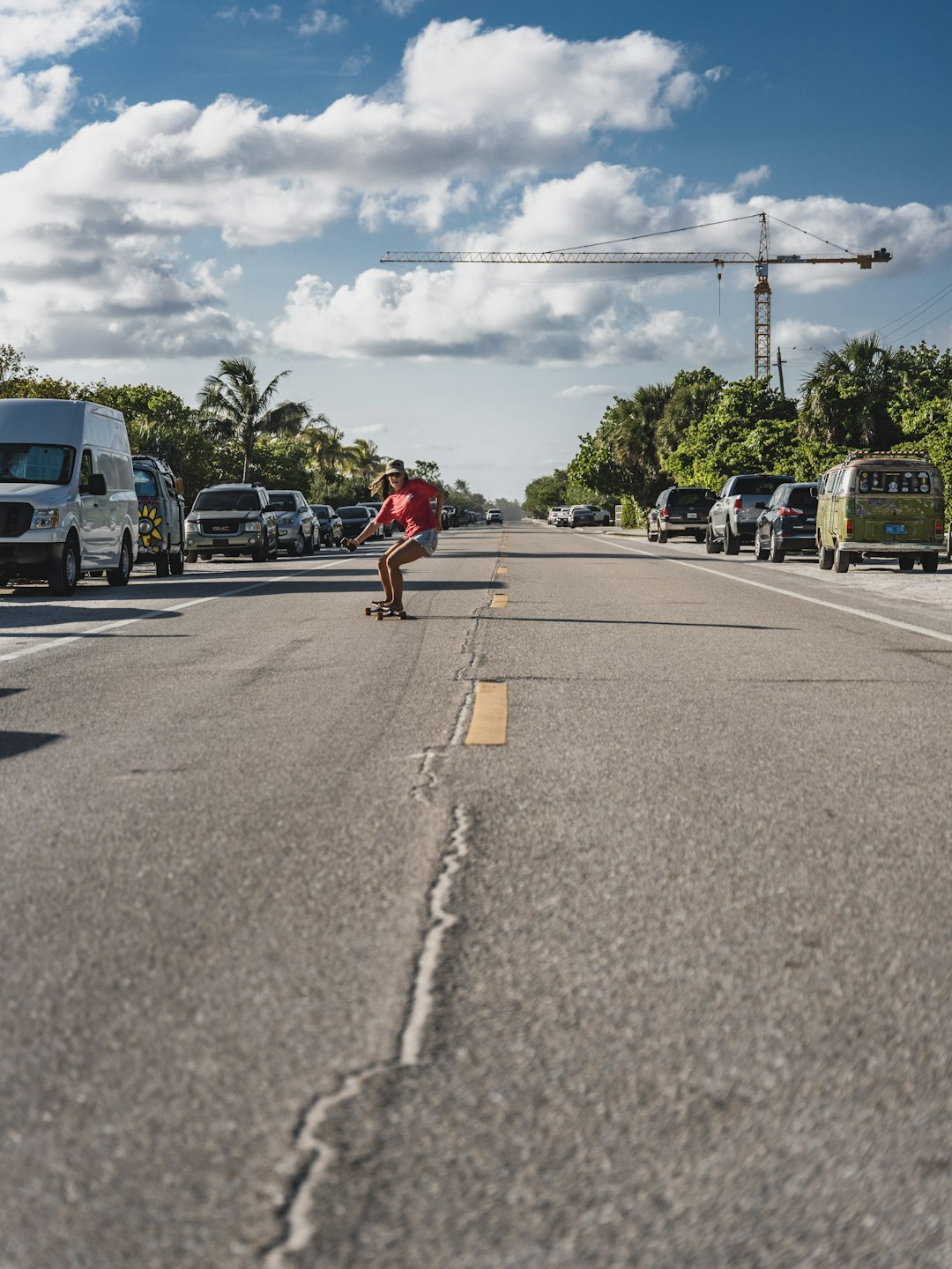 man in red shirt riding bicycle on road during daytime