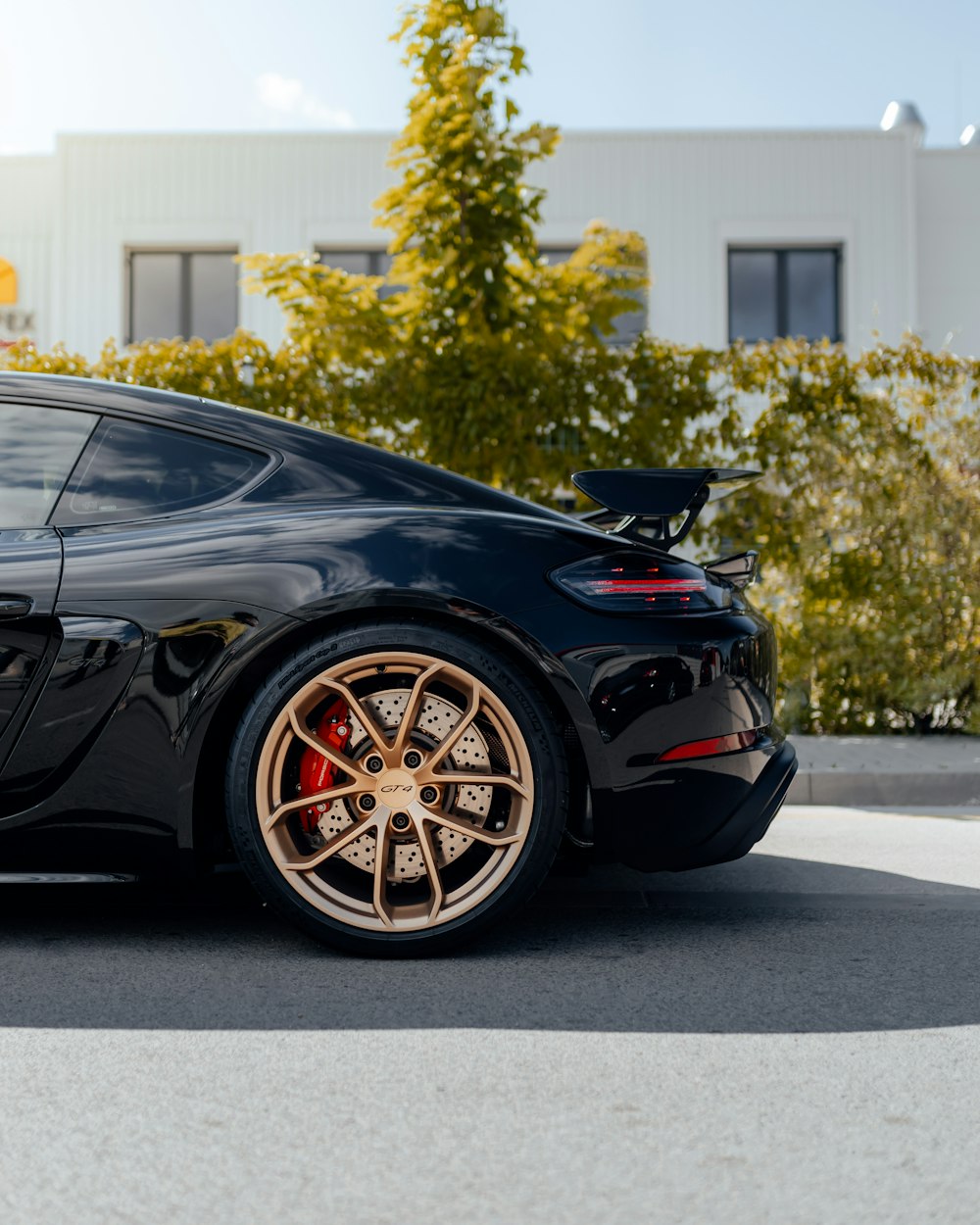 black porsche 911 parked on parking lot during daytime