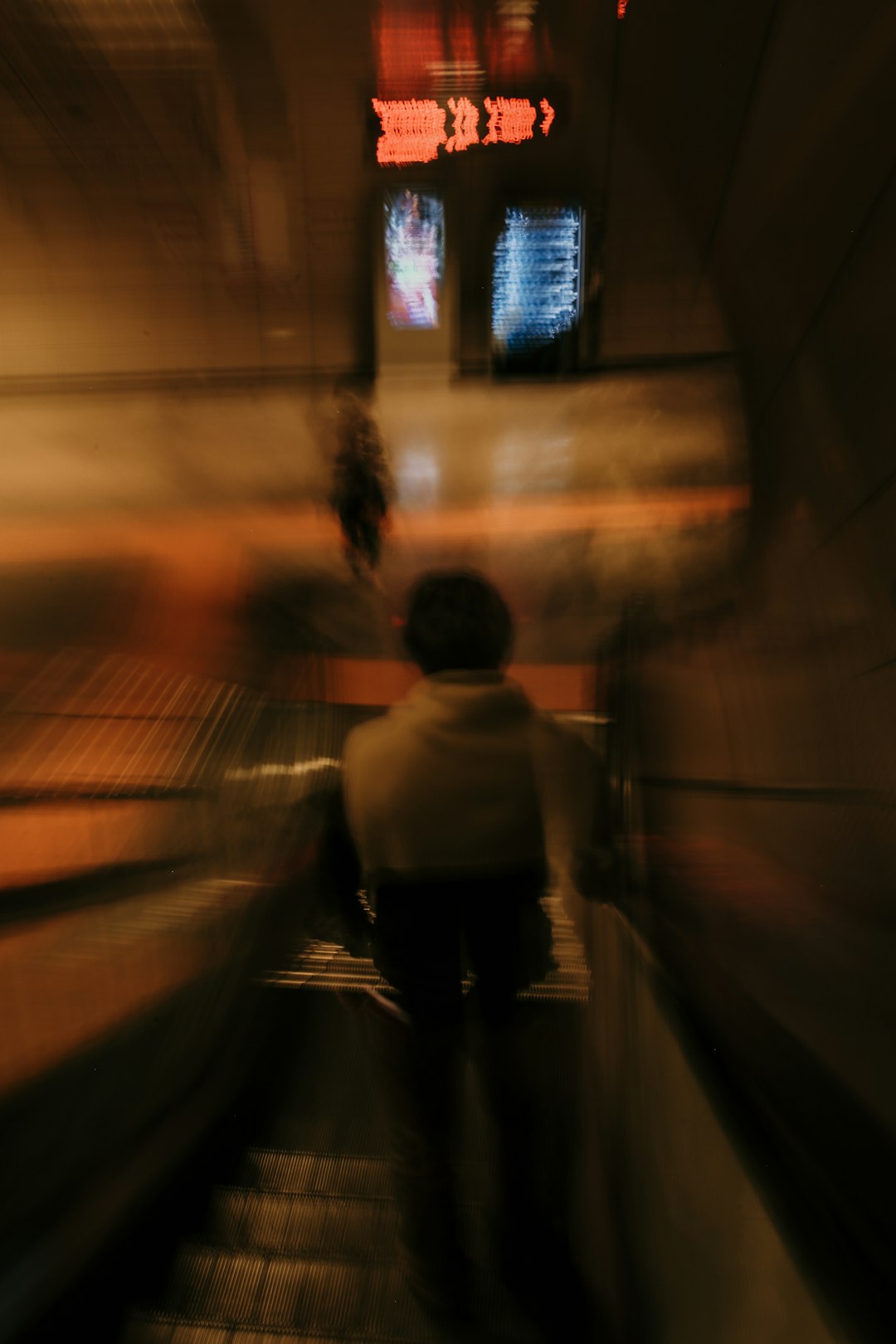 man in white shirt walking on tunnel during daytime