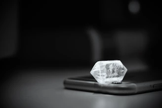 A durable tempered glass screen protector catching light with a crystal-clear shine.