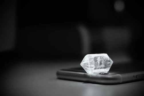 A durable tempered glass screen protector catching light with a crystal-clear shine.