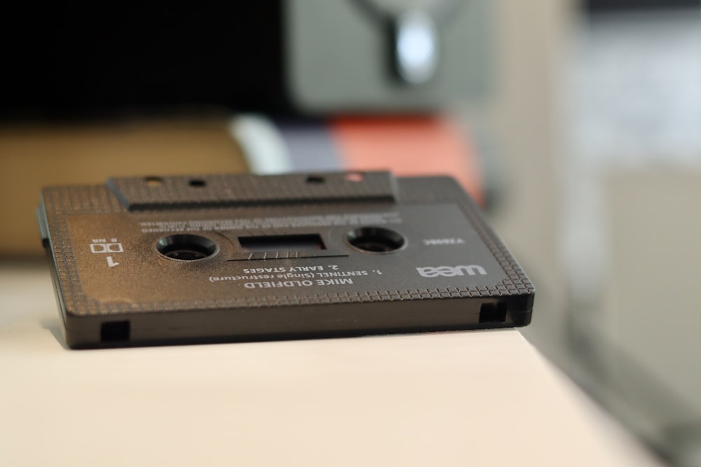 black cassette tape on white table