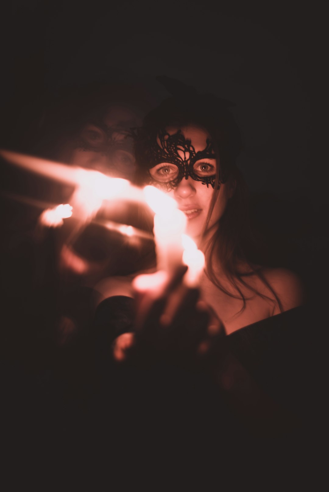 woman in black framed eyeglasses holding lighted cigarette stick