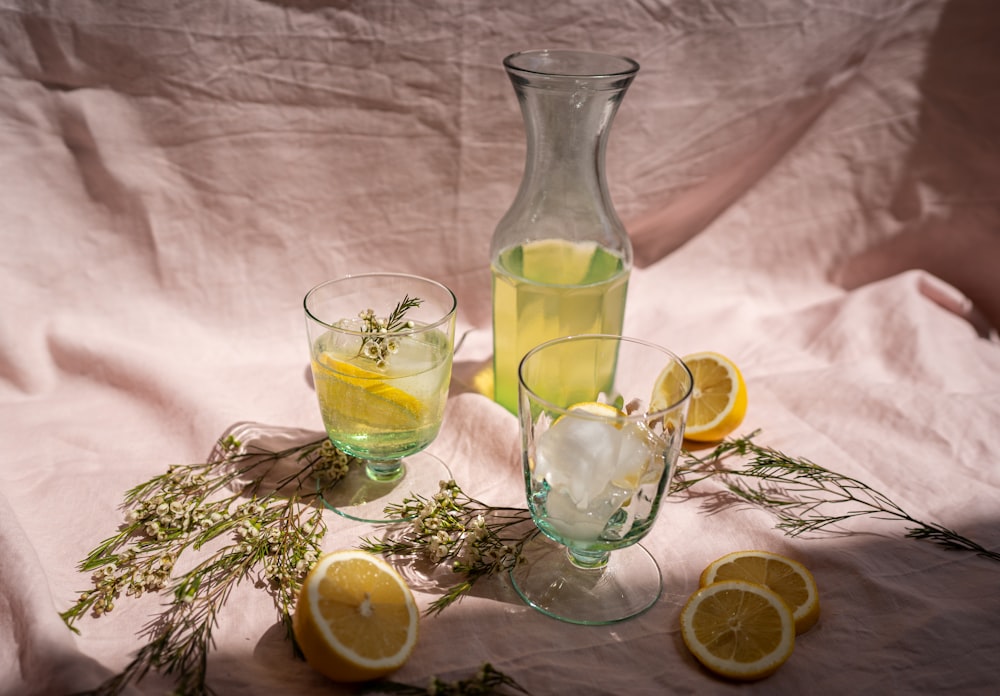 clear glass pitcher with lemon juice