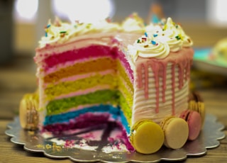 yellow and pink cake on clear glass tray