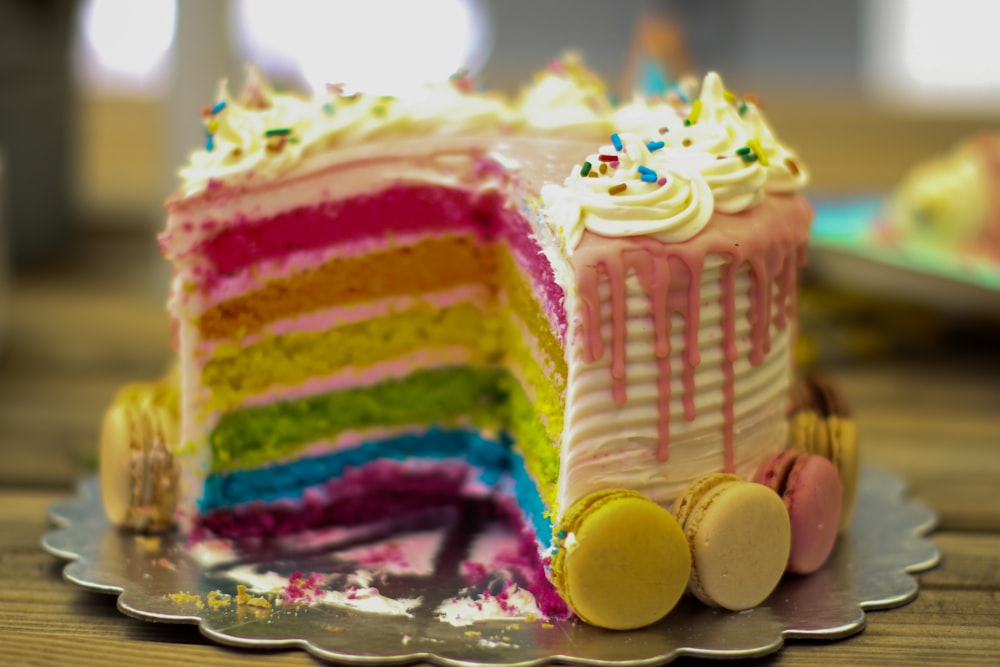 yellow and pink cake on clear glass tray