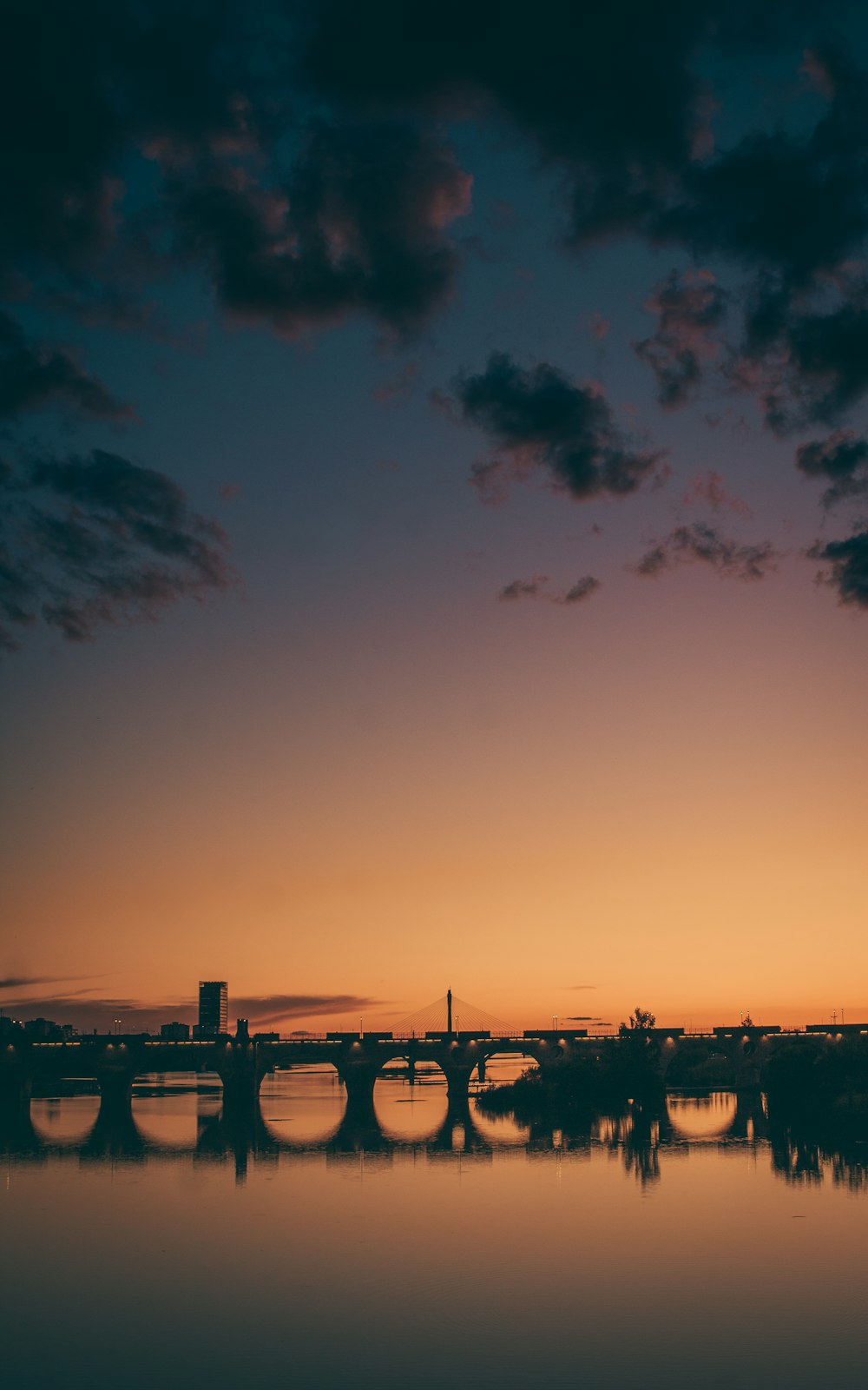 silhouette of bridge during sunset