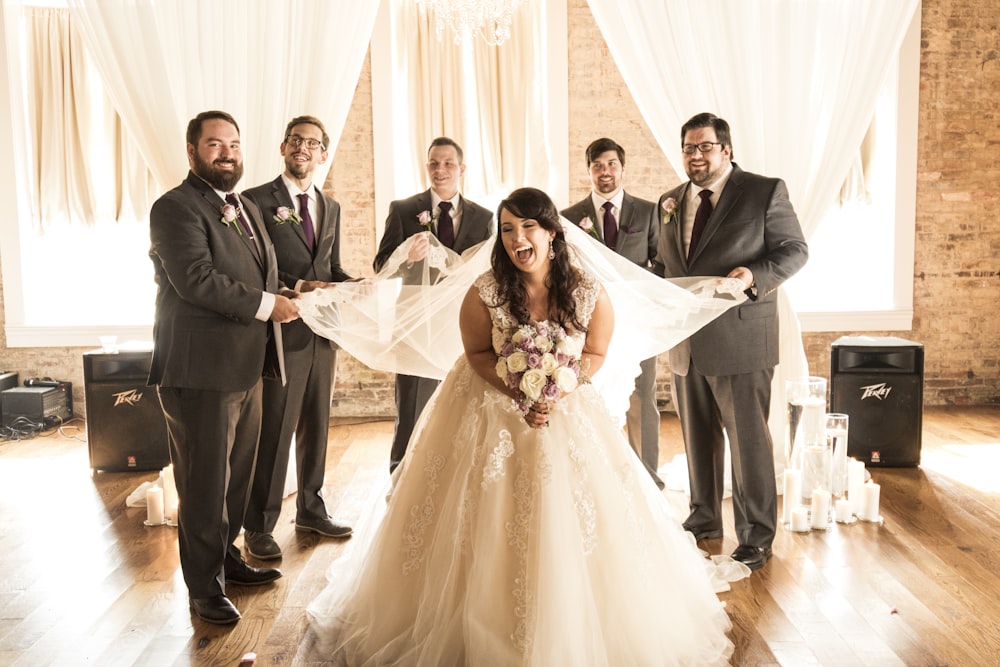 bride and groom standing on white floor