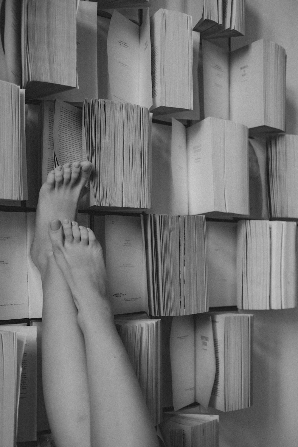 persons feet on brown cardboard box