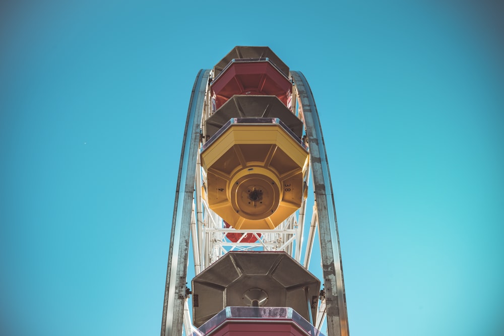 red and yellow tower under blue sky during daytime