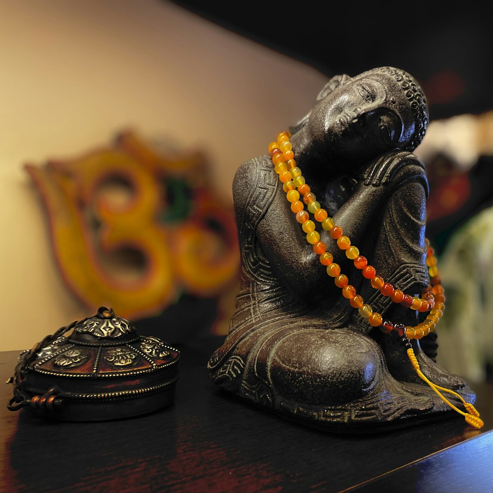 black and gold buddha figurine