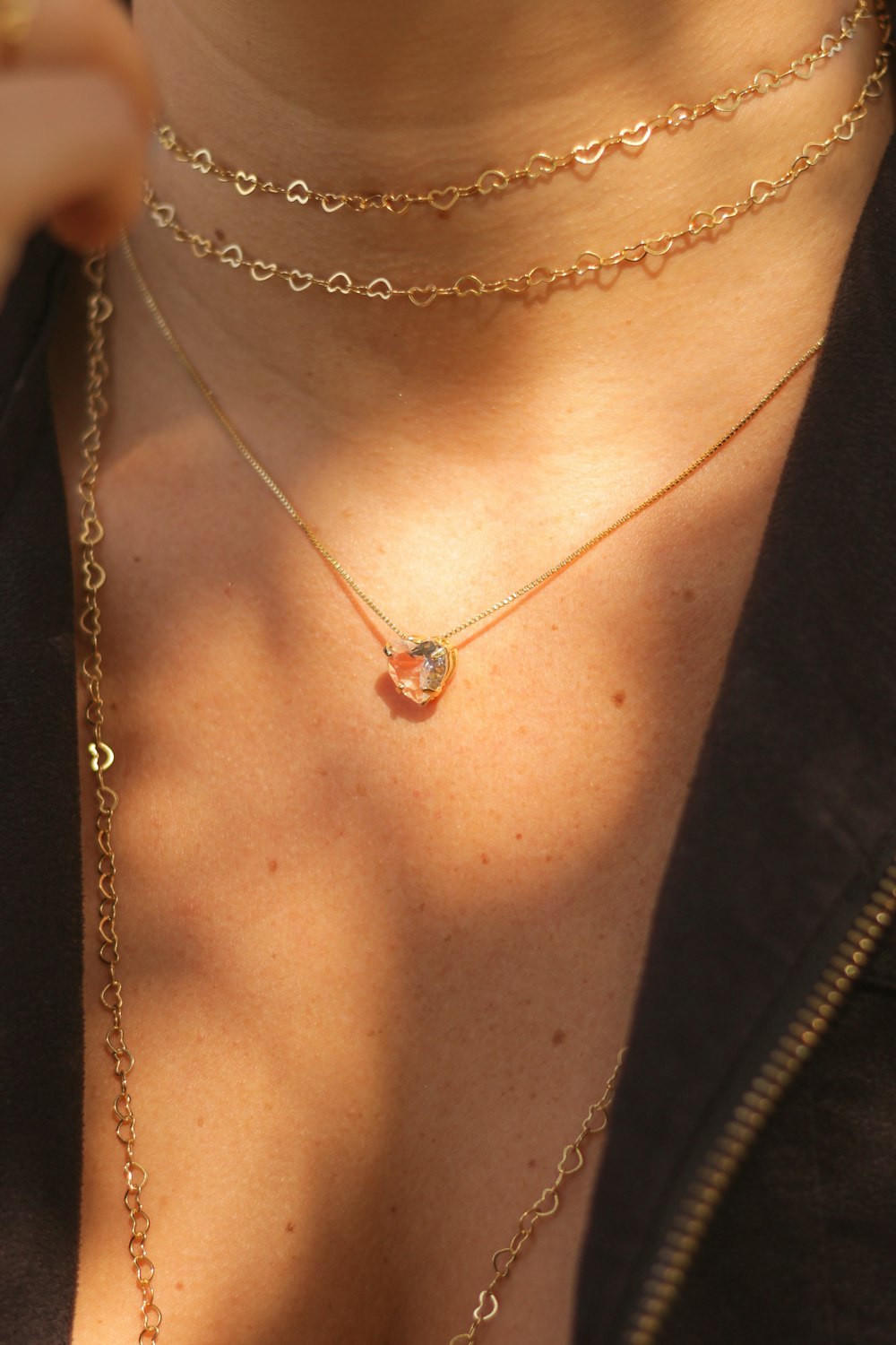 woman wearing silver necklace and black shirt