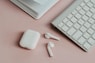 apple magic mouse on white desk