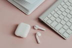 apple magic mouse on white desk