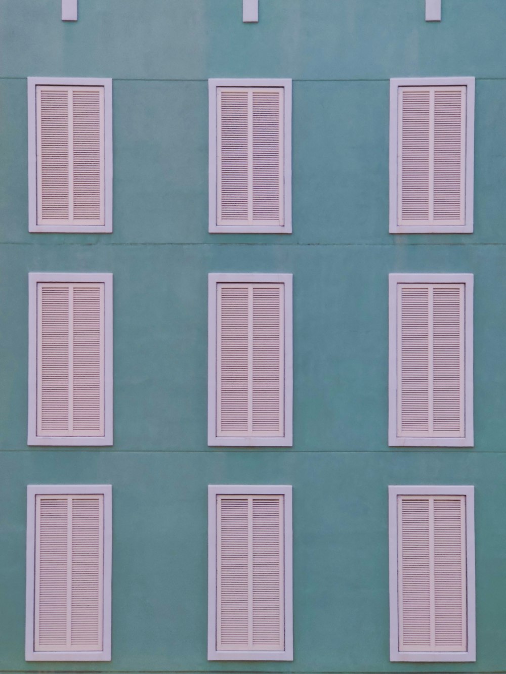 teal and white concrete building