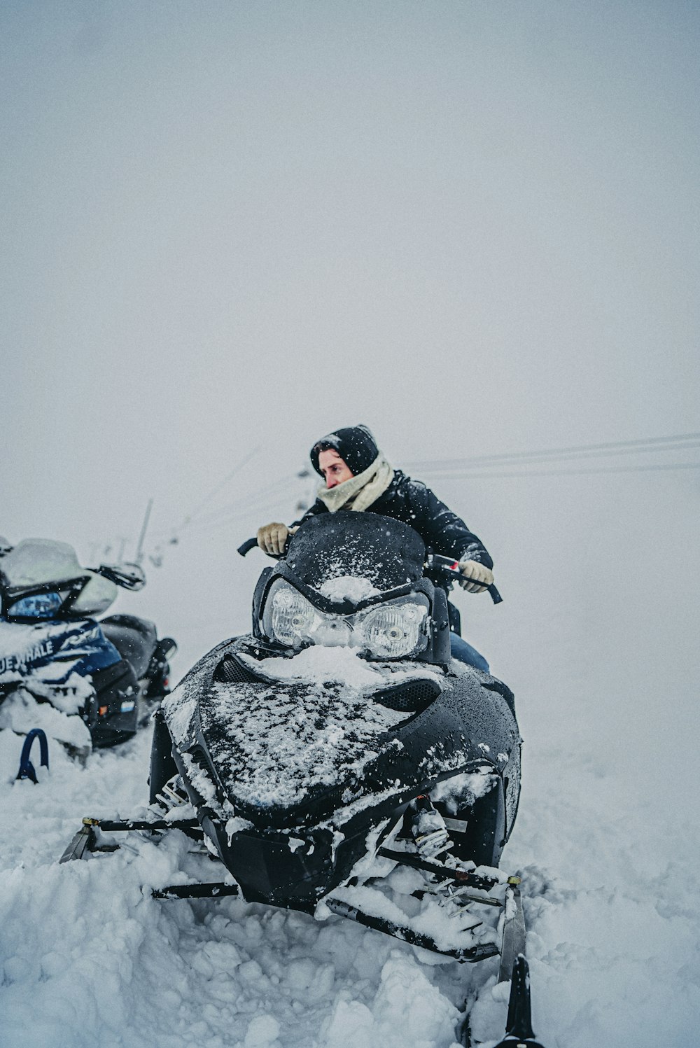 black and gray motorcycle on snow covered ground